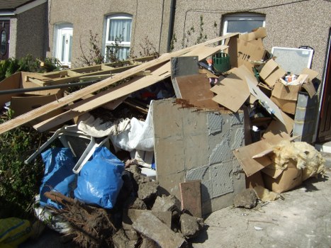 Construction site with a large builders skip for waste management